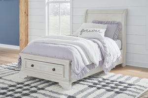 Elegant, timeless furnishings take your bedroom to the next level. Nothing does that better than this twin sleigh bed with storage footboard. The antiqued white finish with a wonderful grain texture radiates sophistication, while drawers with dark bronze-