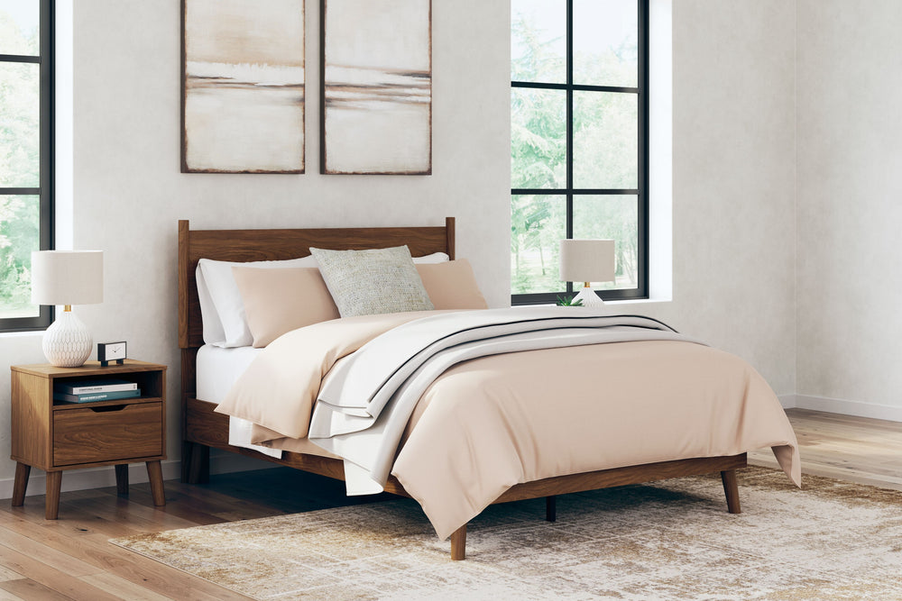 What do you get when you mix a minimalist profile with a warm finish? With sleek simplicity and a rich auburn hue, this full panel bed delivers cool, contemporary style with a nod to mid-century modern design. Talk about completing your restful retreat wi