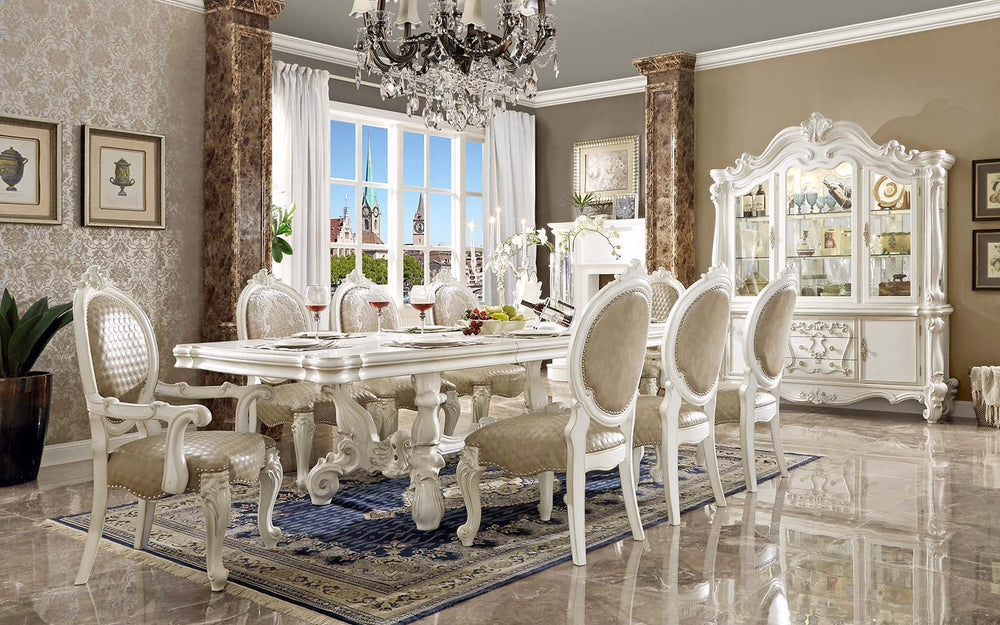Irresistibly inviting, the Versailles collection displays the unrivaled beauty of the traditional dining. The dining table reflects highly decorative base with oversized scrolled feet, and the upholstered and tapestried chairs with deep button tufted and 