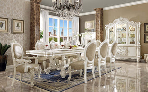Irresistibly inviting, the Versailles collection displays the unrivaled beauty of the traditional dining. The dining table reflects highly decorative base with oversized scrolled feet, and the upholstered and tapestried chairs with deep button tufted and 