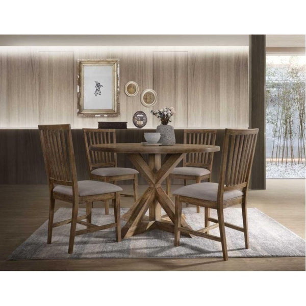 Enhance your dining space with the sophisticated Wallace dining set. This simple table features a weathered finish with the understated styling of transitional design. The sturdy round dining table that features a sophisticated trestle base with a unique 
