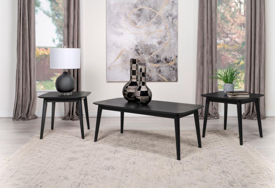 Amid the modern milieu, a three-piece coffee occasional table set stands as a beacon of mid-century inspiration. The coffee table, along with its twin end tables, boasts a black finish so deep it seems to hold secrets within its ash veneer wood grain. Ele