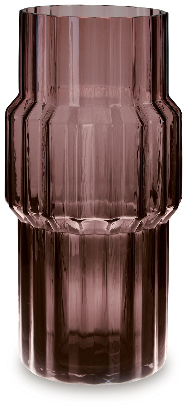 This vase, made of dark mauve-tinted glass, adds a captivating touch to indoor or outdoor decor. Its unique textured shape with oversized fluted detail creates an elegant art piece. Whether it-'s accentuating flowers or candlelight, this vase is simply st