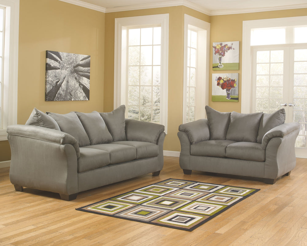 Everyone can have the best seat in the house with this sofa and loveseat. An indulgent choice with deep seats crafted for cloud-like softness, this set is the ideal merger of modern flair and classic staying power. <h4><b>Darcy - Cobblestone - Sofa</b></h