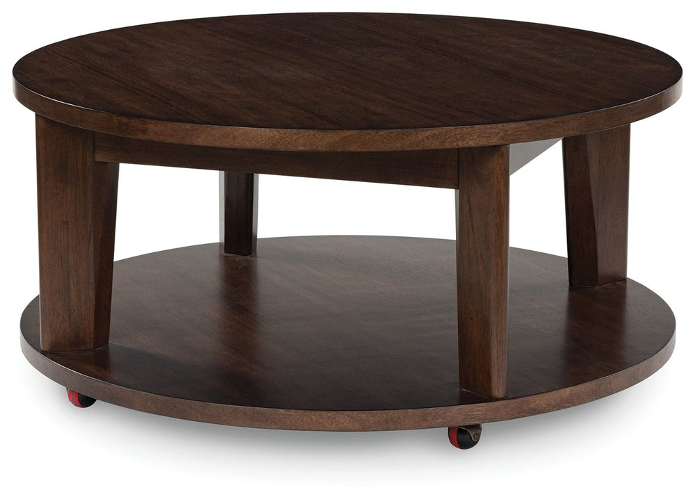 It-'s hard to say what-'s most striking about this round coffee table. Is it the rich warm brown finish or the thick tapered legs? Either way, the table-'s clean, contemporary aesthetic is perfect for your casual lifestyle. Casters let you roll the coffee