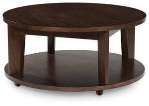 It-'s hard to say what-'s most striking about this round coffee table. Is it the rich warm brown finish or the thick tapered legs? Either way, the table-'s clean, contemporary aesthetic is perfect for your casual lifestyle. Casters let you roll the coffee