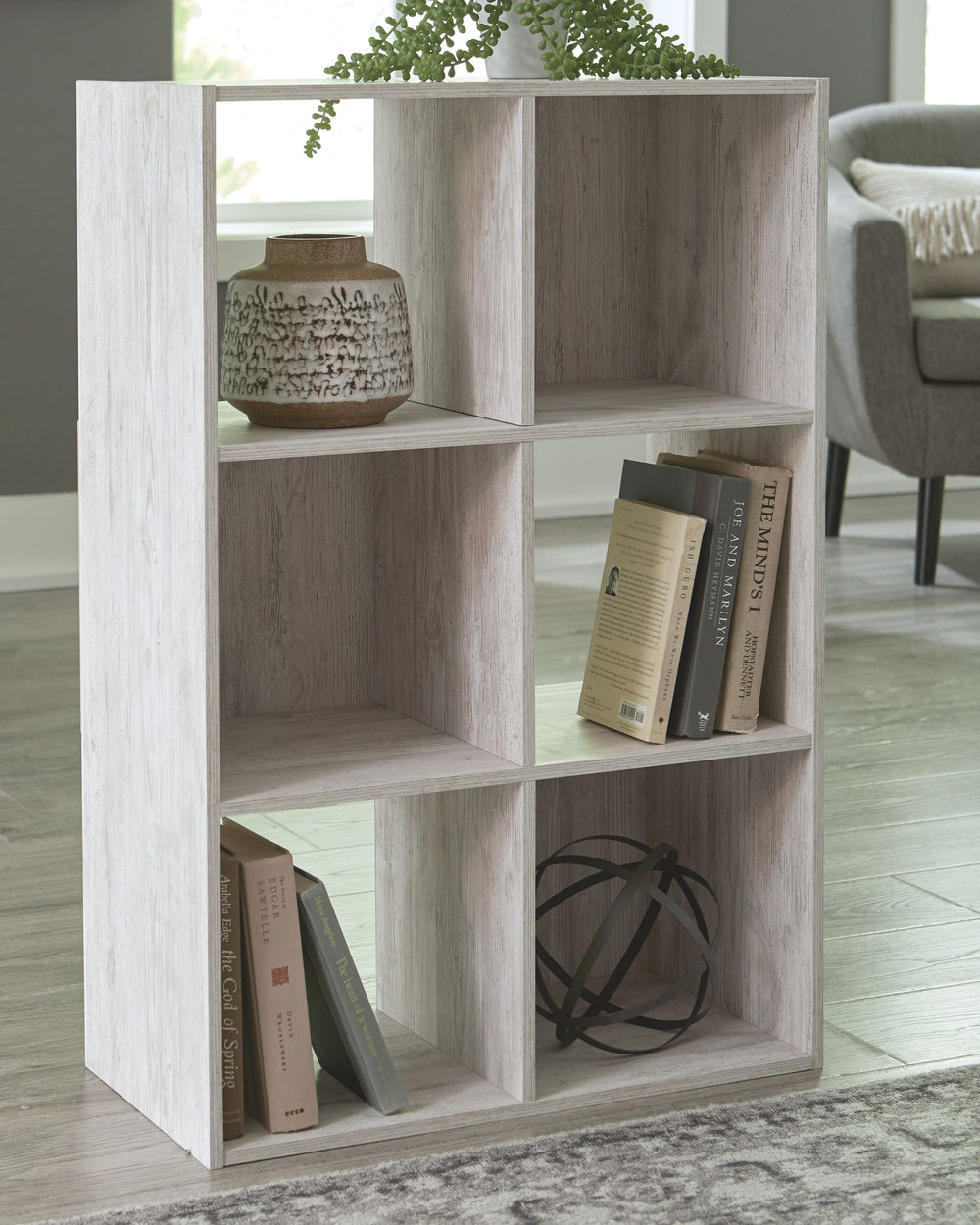 If itâ€™s coastal chic or cottage quaint style you long for, the Paxberry whitewashed six-cube organizer invites you to go to town. Its distinctive weatherworn finish conveys an easy-breezy sensibility, perfect for a restful bedroom retreat. Open and clos