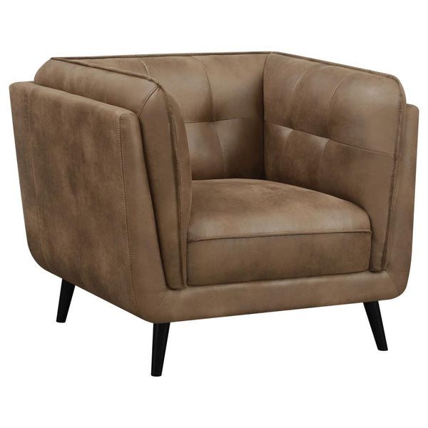 Transform your mid-century modern living room seating area with this contemporary shelter style lounge chair, designed in an updated Chesterfield style complete with plush grid tufted seats and cushions upholstered in a soft and smooth brown microfiber le