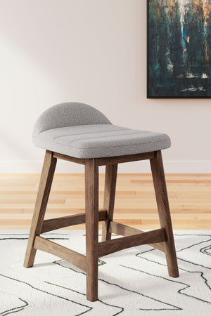  capturing the architectural language of mid-century stylings. The seat invites the eye with a soft-edged silhouette and light gray cus