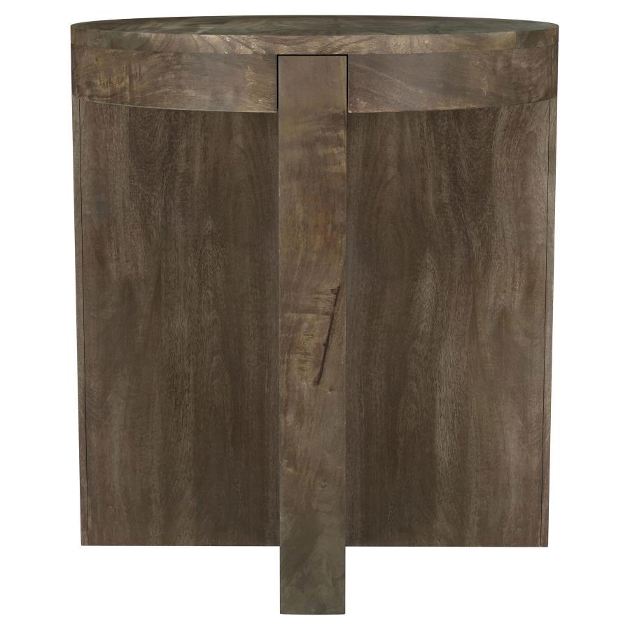 Thick slabs of beautiful mango wood create a compelling silhouette for a modern wooden end table. Its round top creates a cohesive feel, while thick legs add substance. A deep brown finish complements the wood to perfection, offering a sense of sophistica