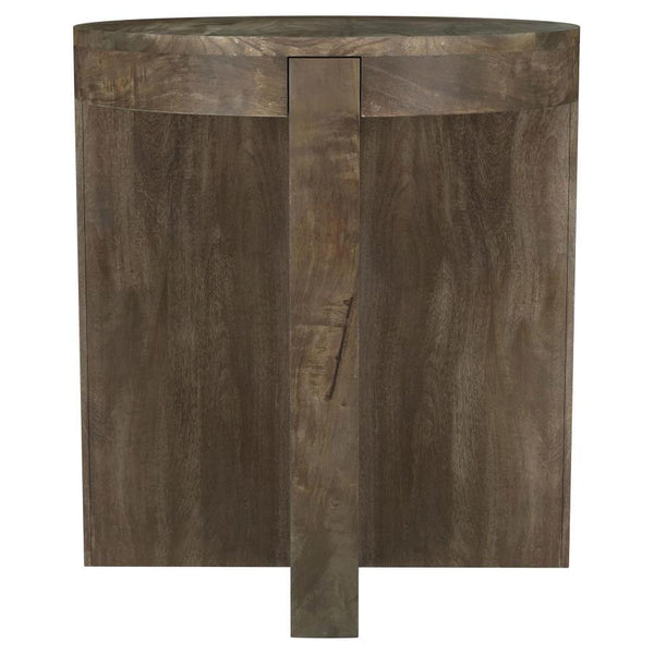 Thick slabs of beautiful mango wood create a compelling silhouette for a modern wooden end table. Its round top creates a cohesive feel, while thick legs add substance. A deep brown finish complements the wood to perfection, offering a sense of sophistica
