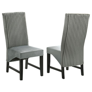 Elevate your dining space with these sophisticated dining chairs, blending textures and luxurious fabrics for a modern, elegant look. The seat back features wide channel corduroy upholstery, adding rich texture and a stylish visual contrast. The seat itse