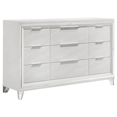 Add a touch of elegance to your bedroom with this spacious 9-drawer dresser, featuring a modern Italian design. The white finish, combined with picture framed recessed panels and embossed herringbone graphic patterns, creates a sophisticated look. Accente