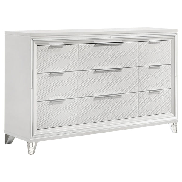 Add a touch of elegance to your bedroom with this spacious 9-drawer dresser, featuring a modern Italian design. The white finish, combined with picture framed recessed panels and embossed herringbone graphic patterns, creates a sophisticated look. Accente
