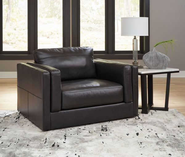  the plush cushions are wrapped with a combination of leather and expertly matched fau