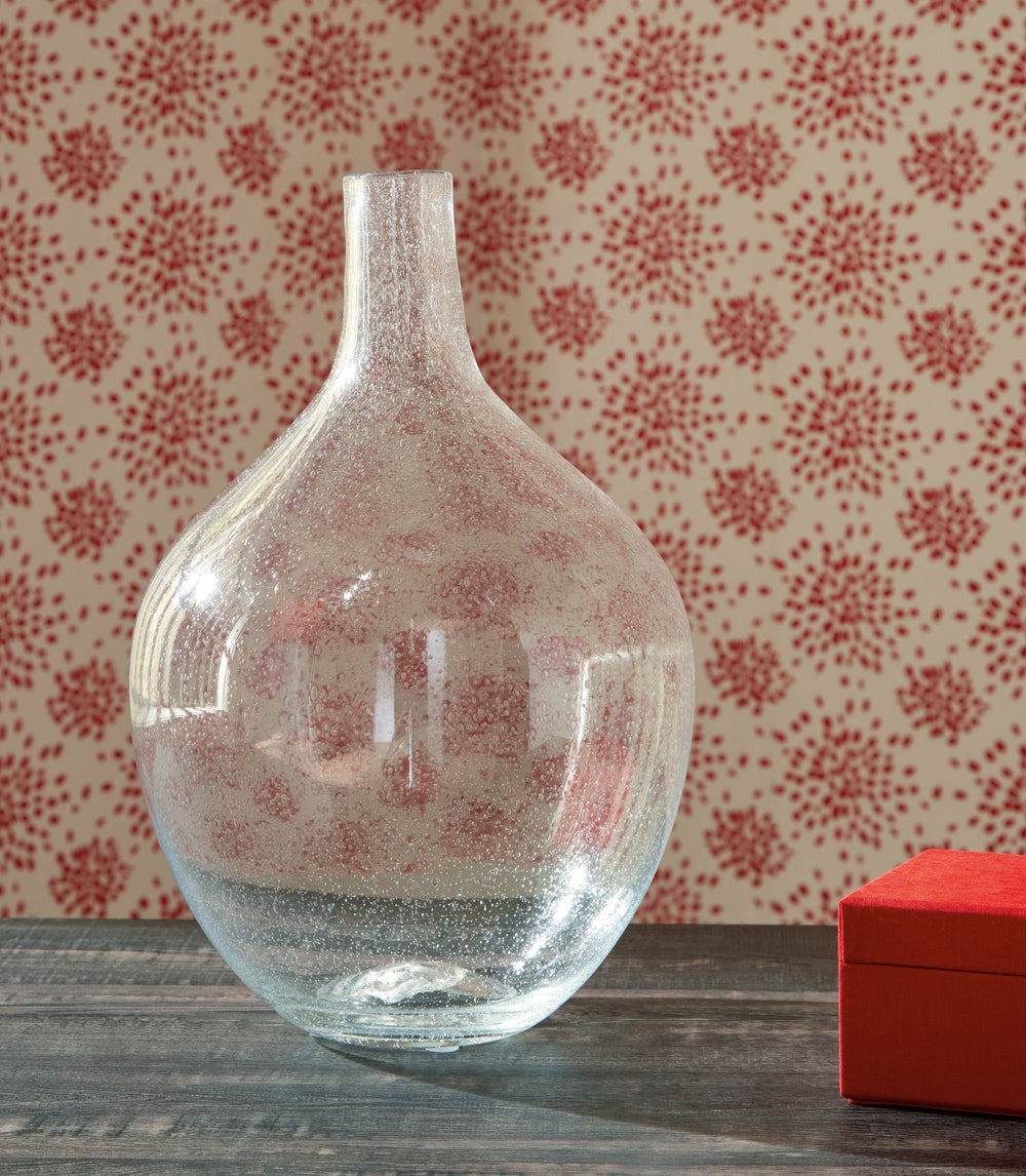 Infuse your shelf, mantel or tabletop with casual charm. Crafted from clear seeded glass, this vase effortlessly captures the essence of weathered beauty. Whether it-'s indoors or outdoors, this vessel is enchantingly simple unadorned or filled with your 