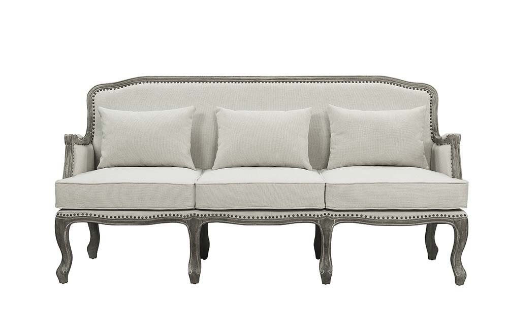 Finely crafted with superb carved details and a lovely natural finish, the Tania sofa flaunts a French cabriole silhouette that perches on graceful cabriole legs and showcases its antique-inspired profile. The nailhead trim accents give this piece a moder