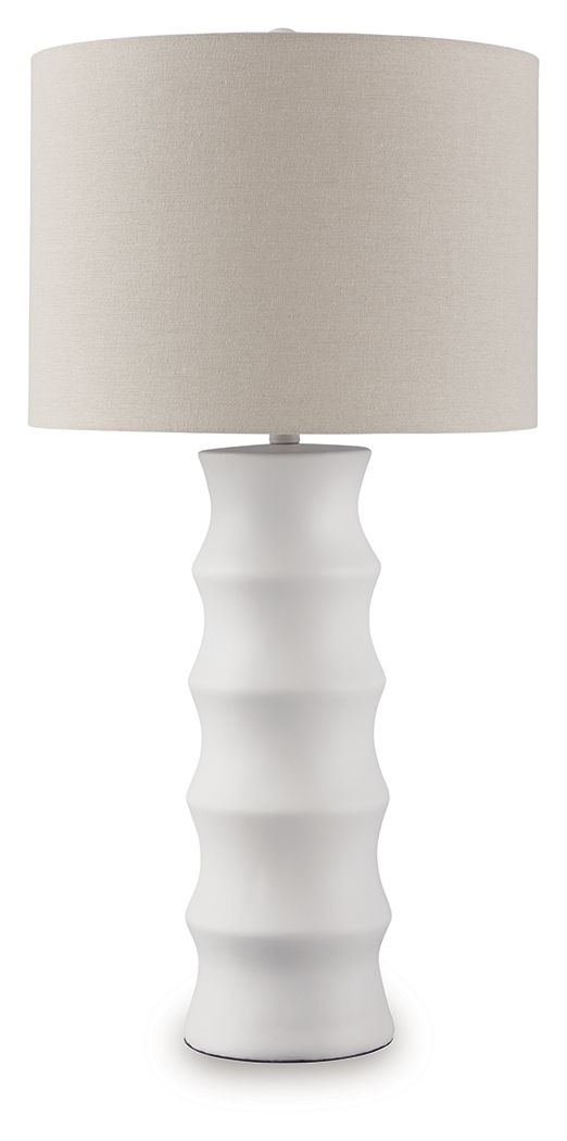 Add flair to your lair with this striking table lamp. With a distinctive scalloped design and a fresh white finish, itâ€™s cool from every angle. And its versatile style looks right at home everywhere from contemporary places to casual spaces. The matchin