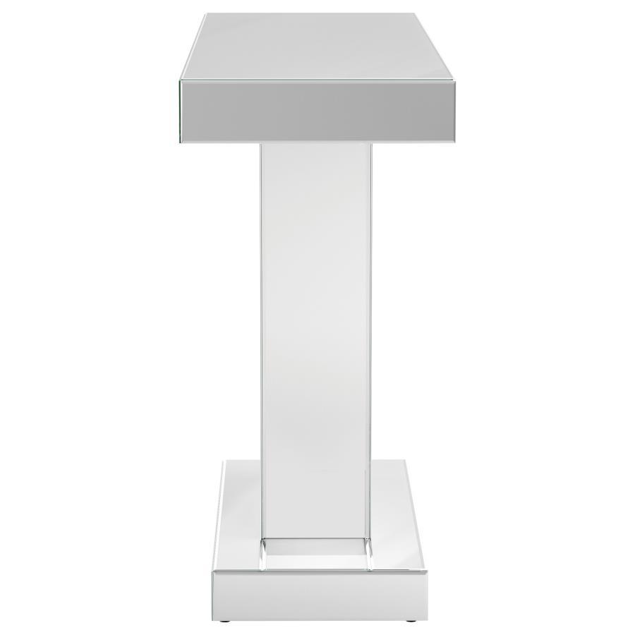 Make a bold statement with this contemporary glam console table, designed to impress with its striking silhouette and luxe materials. The silver mirrored finish is paired with a geometric W-shaped base, inlaid with shimmering faux crystal accents for a da