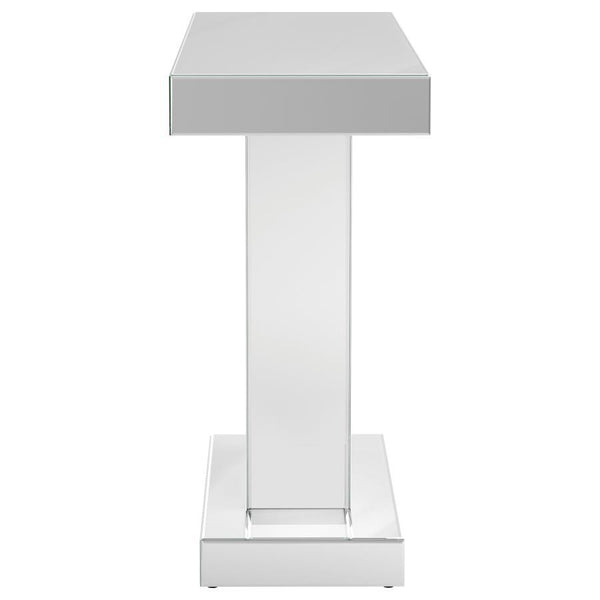  designed to impress with its striking silhouette and luxe materials. The silver mirrored finish is paired with a geometric W-shaped base
