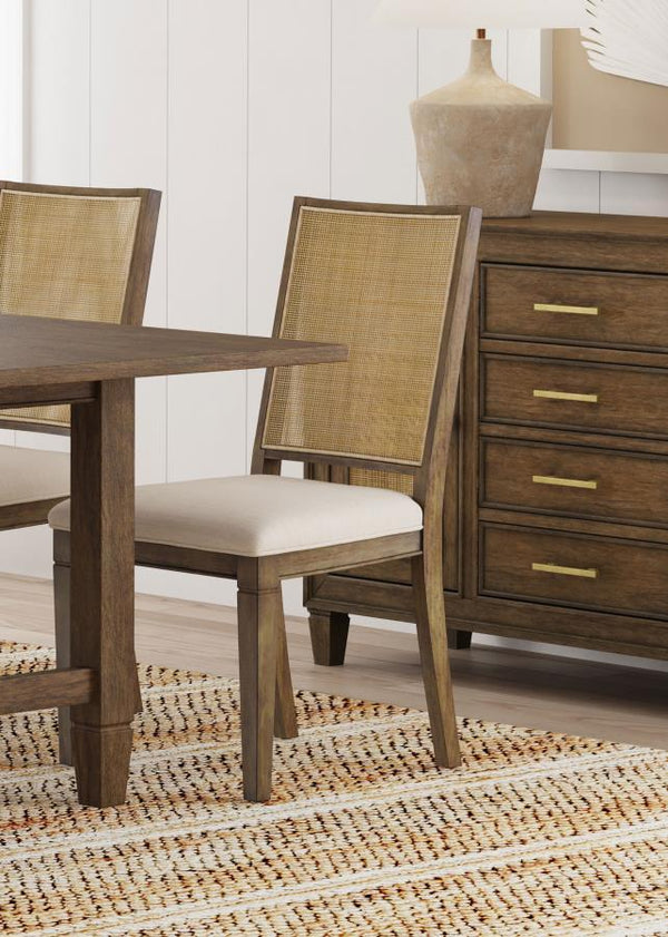  the chair features a plush foam seat with beige upholstery. Its back is rattan