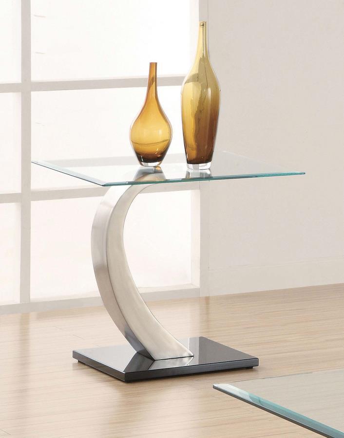 This end table combines style and durability with its tempered glass top and sleek design. The gracefully curved base features a brushed satin silver finish, adding modern elegance, while the polished black platform base provides striking contrast and stu