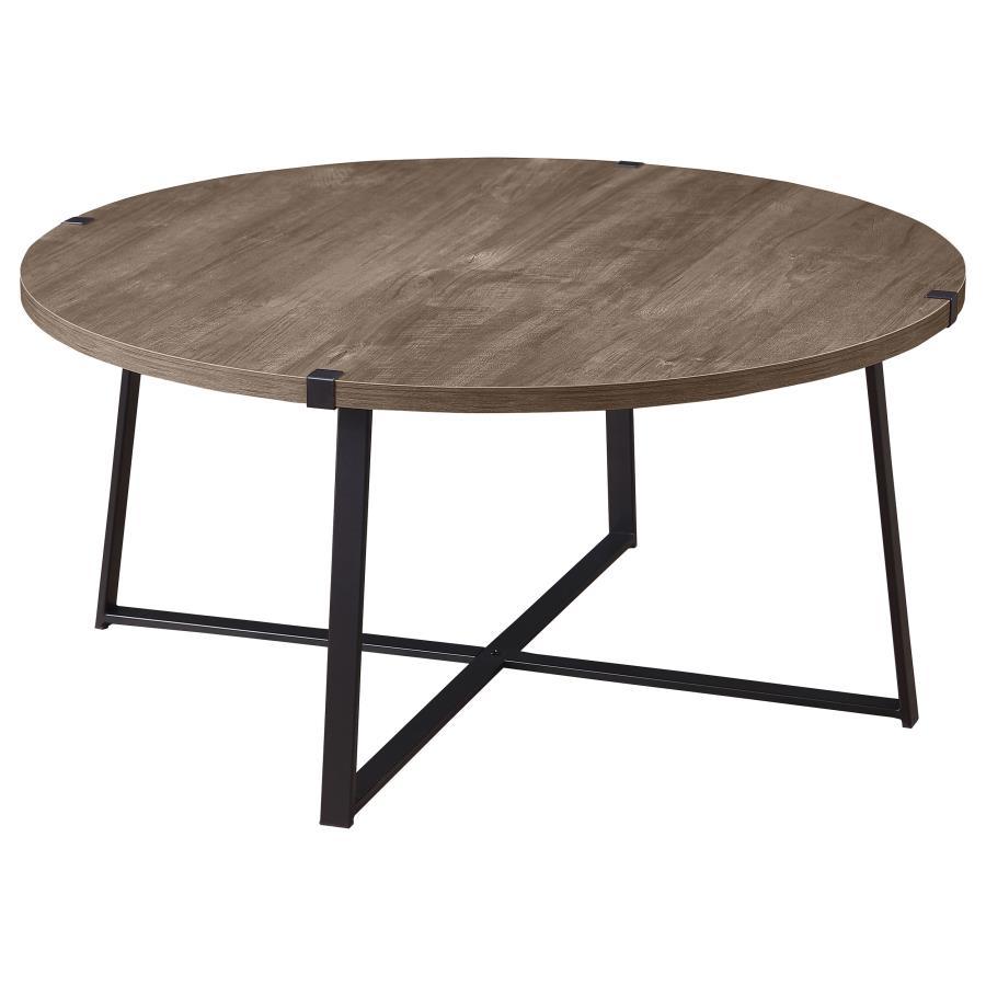 Augment an inviting living space with the stylish look of a modern round coffee table. The table pairs a light brown engineered wood top with a realistic wood grain texture, creating a sense of warmth. The sturdy metal base features a black powder-coated 