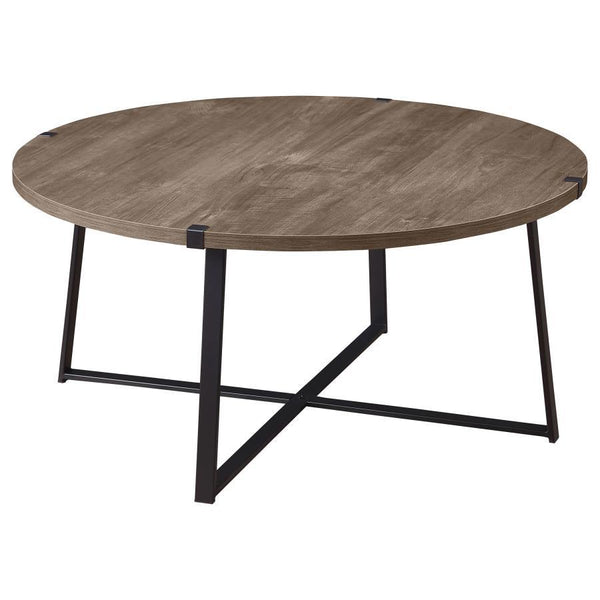 Augment an inviting living space with the stylish look of a modern round coffee table. The table pairs a light brown engineered wood top with a realistic wood grain texture, creating a sense of warmth. The sturdy metal base features a black powder-coated 
