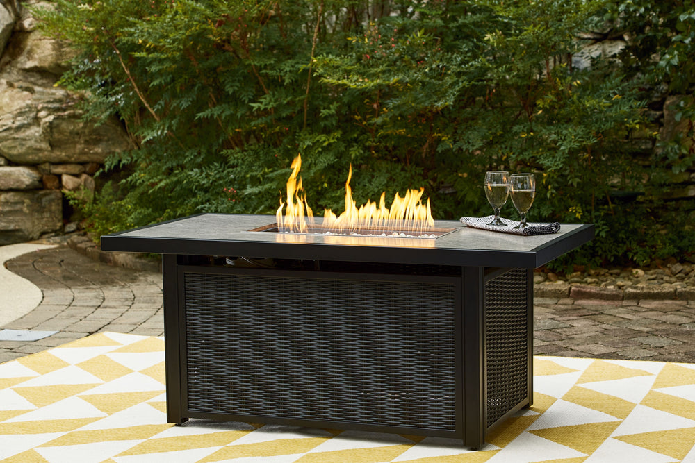 Sporting an easy-on-the-eyes elegance, this fire pit table elevates the art of alfresco living. Its handpainted top is paired with all-weather resin wicker over rust-proof aluminum for beauty and brawn. A stainless steel burner with glass beads adds a cap