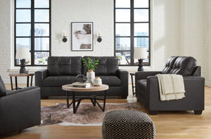 Everyday comfort meets versatile style in this sofa with matching loveseat and recliner. The handsome hue of the goes-with-anything faux leather takes away the stress of styling, expertly pairing with your existing aesthetic. From kicking back on the week