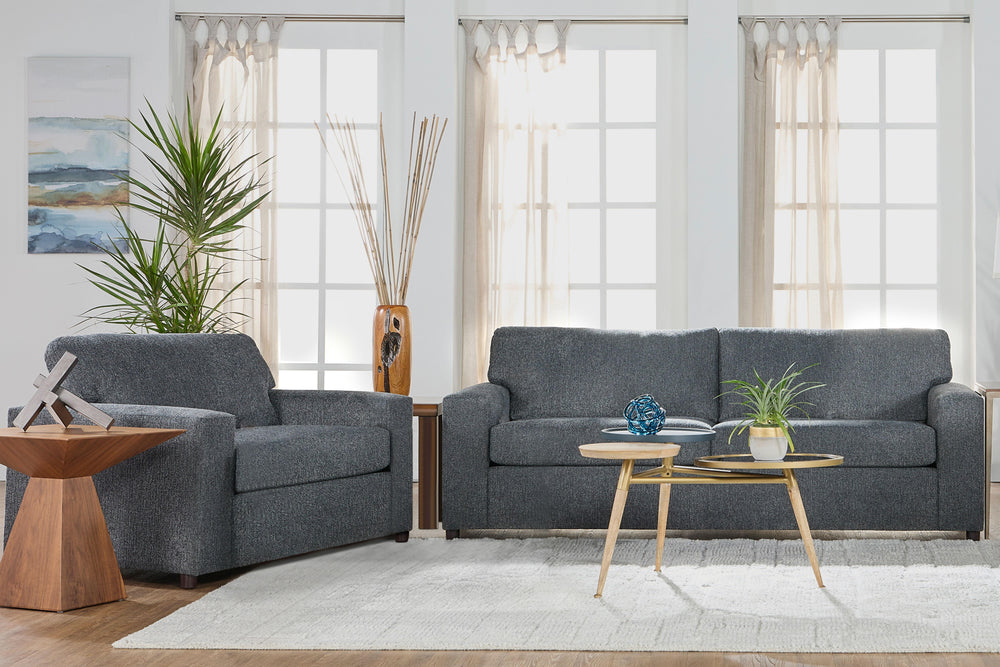 Discover the Kylo Cuddle Chair, a cozy haven designed for unparalleled relaxation. Crafted with easy-care natural beige upholstery, this transitional piece seamlessly blends into any space. Sink into its oversized frame, complete with square arms and plus