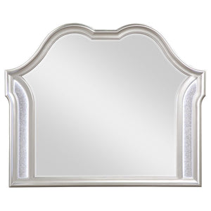  framed mirror. A double arched design crowns the top