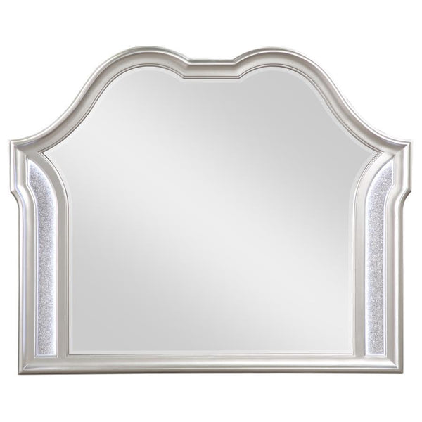  framed mirror. A double arched design crowns the top
