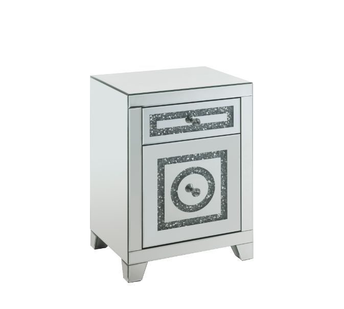The Noralie Accent Table will give any room a touch of glamour. Mirror and glass materials give it a modern and clear touch while faux diamond inlays add glam style to this piece. Use this unique piece as the perfect accent for any room dÃ©cor. It has a s