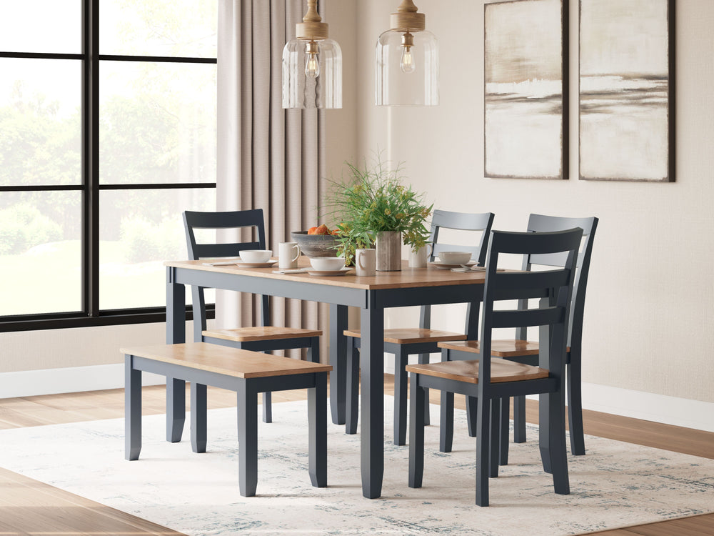 Complement your homeâ€™s simply relaxed sensibility with this dining table, chairs and bench. A dark blue hue offers a chic contrast to the natural wood tone, for a casual look that vibes with a variety of aesthetics. Whether you-'re sipping your morning 