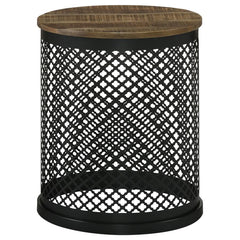 Blending rustic charm with industrial flair, this round accent table makes a striking addition to any space. The solid mango wood top, finished in a deep natural tone, highlights the organic wood grain for a warm, inviting look. The black iron drum base f