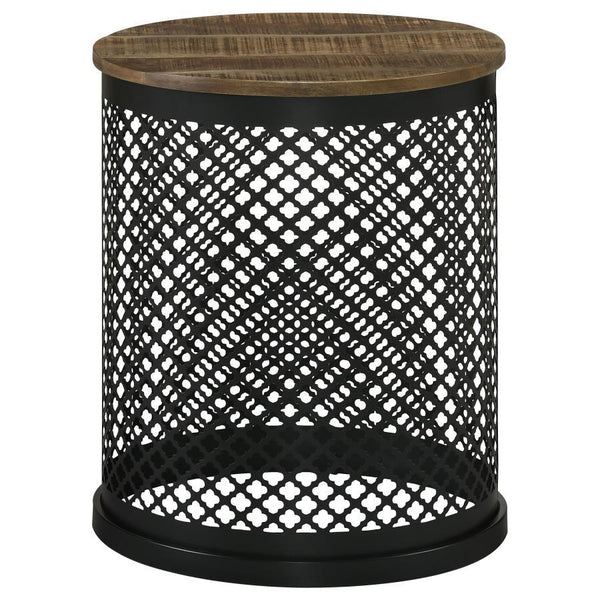 Blending rustic charm with industrial flair, this round accent table makes a striking addition to any space. The solid mango wood top, finished in a deep natural tone, highlights the organic wood grain for a warm, inviting look. The black iron drum base f