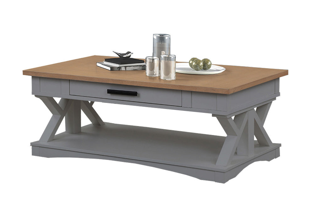 Destined to be the heart of any conversation area, the Americana Modern Cocktail Table is a must-have. Crafted in a versatile Dove grey finish, it features a contrasting wood-grain top in Weathered Natural. A lower open area is perfect for storage and dis