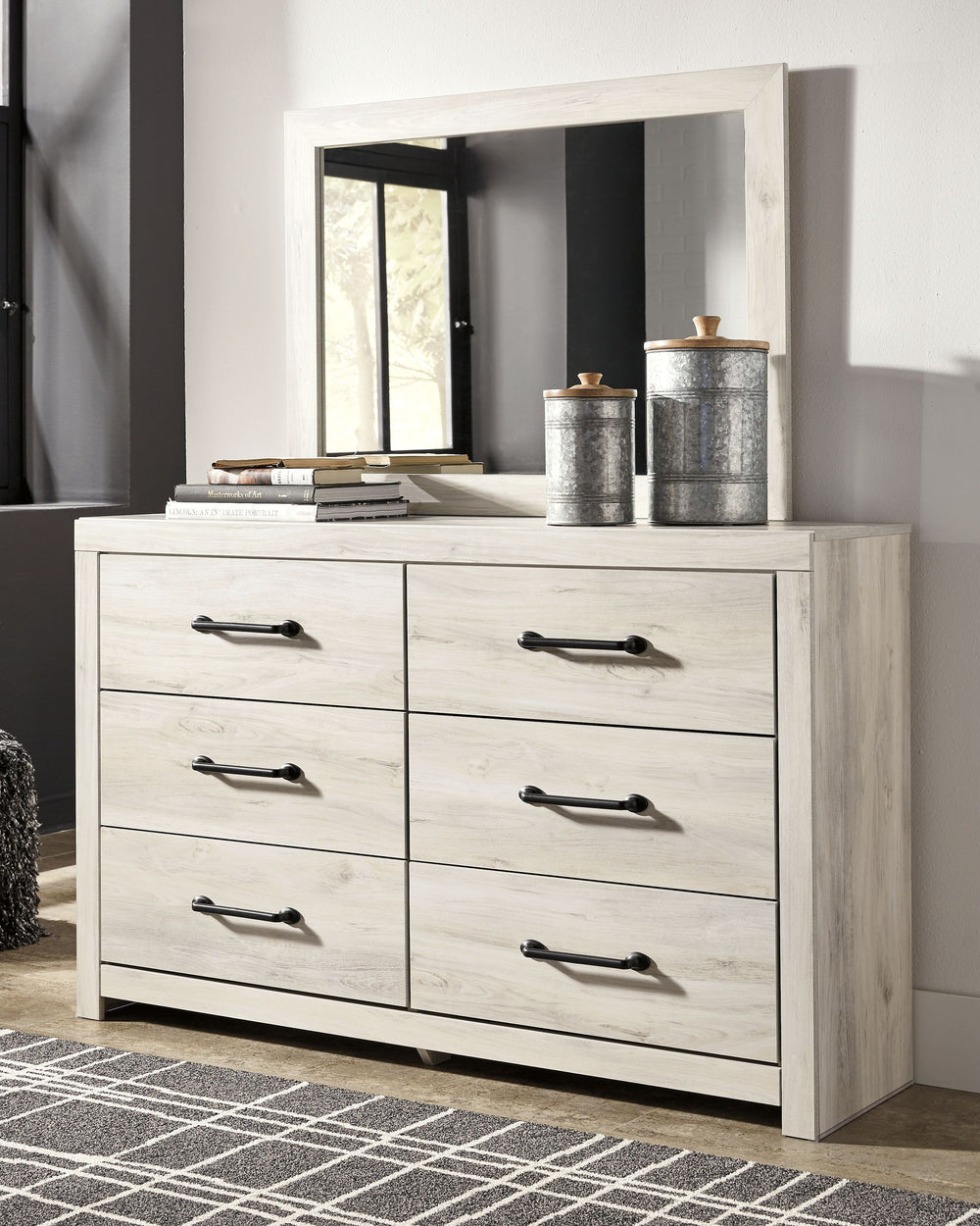 Wispy white finish over replicated Oak grain with authentic touch. Large scaled dark colored handles. Cases feature a framed front and pilasters. All panel headboards (53,57,58,87) feature decorative matte black sconce lights. Side roller glides for smoot