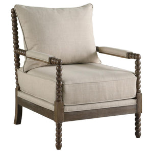 With a modern twist on traditional design, this accent arm chair makes a statement. Warm beige upholstery adds texture to the seat, back, and arms. Rounded sphere details decorate the front legs and frame. Smooth and refined, the silhouette is full of cle