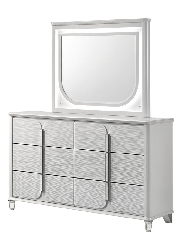 Dive into the luxurious embrace of this chic and polished bedroom collection, where contemporary design meets comfort in a symphony of elegance. At the heart lies a sumptuous bed with a plush, padded headboard with integrated lighting, inviting you to rec