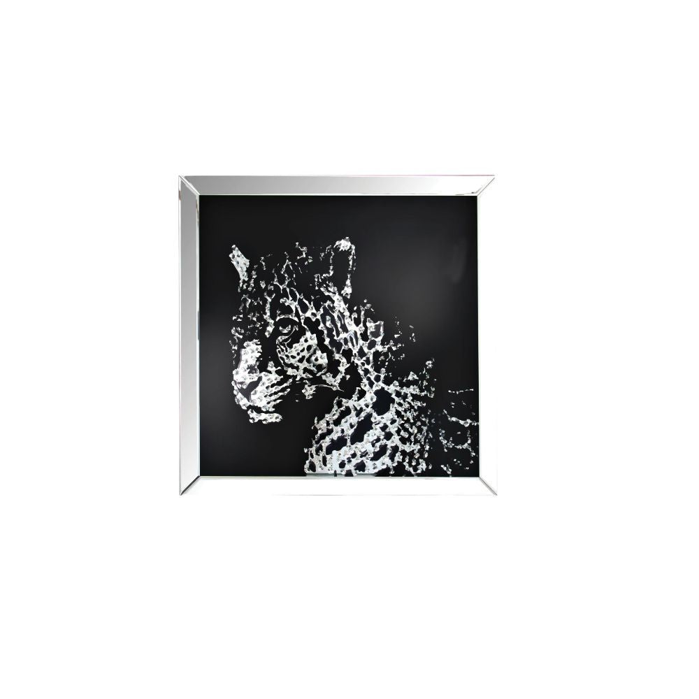 The Nevina crystal wall mirror is sure to be the focal point of any room. Dramatically cast with a leopard shaped mirror that is the perfect contrast against a black background. Faceted optic glass crystals adorn the skill layering it with added luxe and 