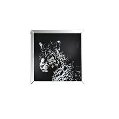 The Nevina crystal wall mirror is sure to be the focal point of any room. Dramatically cast with a leopard shaped mirror that is the perfect contrast against a black background. Faceted optic glass crystals adorn the skill layering it with added luxe and 