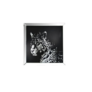 The Nevina crystal wall mirror is sure to be the focal point of any room. Dramatically cast with a leopard shaped mirror that is the perfect contrast against a black background. Faceted optic glass crystals adorn the skill layering it with added luxe and 
