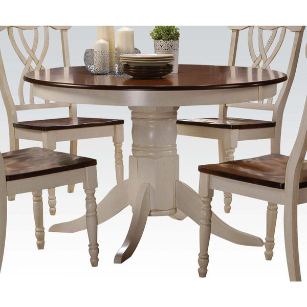The Dylan collection features round table top with empire pedestal base, carefully crafted with selected wood and veneers in buttermilk and oak finish. Matching side chairs offer overlapped -"X-" backrest design, wooden seat top, and turned front legs pro