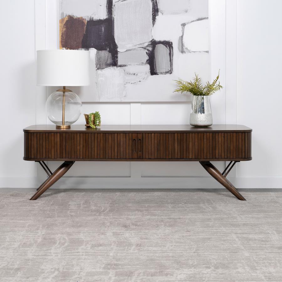 As the centerpiece of any sophisticated living room, this 71" TV stand, with its mid-century modern design, brings a touch of elegance and timeless charm. Its sleek silhouette is perfectly complemented by the rich walnut finish, offering a warm, inviting 
