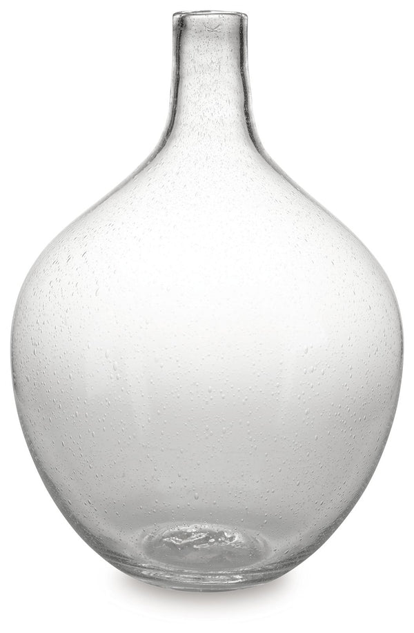 Infuse your shelf, mantel or tabletop with casual charm. Crafted from clear seeded glass, this vase effortlessly captures the essence of weathered beauty. Whether it-'s indoors or outdoors, this vessel is enchantingly simple unadorned or filled with your 