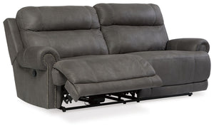  nailhead trim and a -"weather worn-" effect on the upholstery give thi