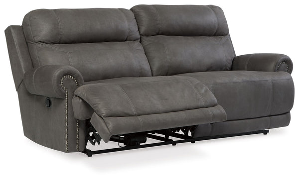  nailhead trim and a -"weather worn-" effect on the upholstery give thi