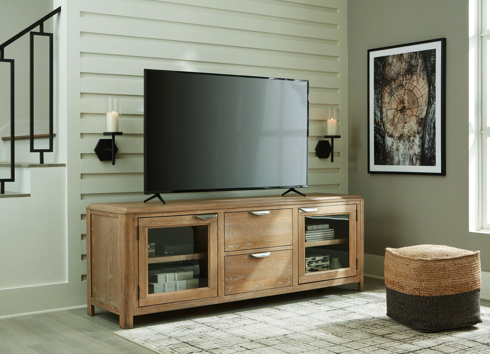 This TV stand-'s classic yet contemporary good looks are hard to deny. Softly shaped posts with a light oak finish and wire-brushed wood grain texture lend an organic appeal to your entertainment space. Roomy drawers are just the ticket for extra media st